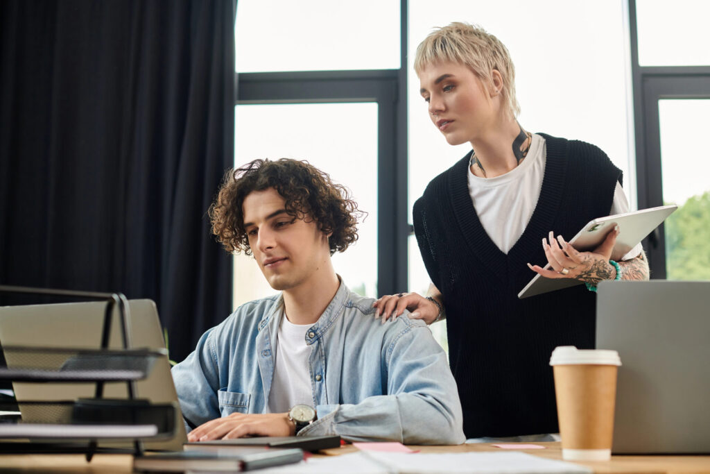 Employees collaborating in a workplace environment, representing talent beyond the traditional applicant pool.