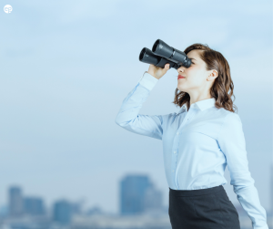 Woman searching with binoculars