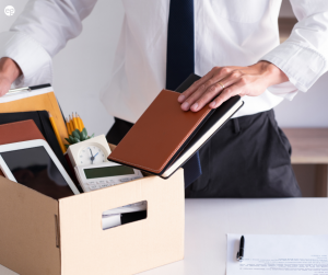 Man packing up his desk after resigning