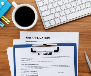 Resume and job searching supplies on a desk