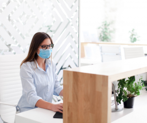 Masked women working in an office